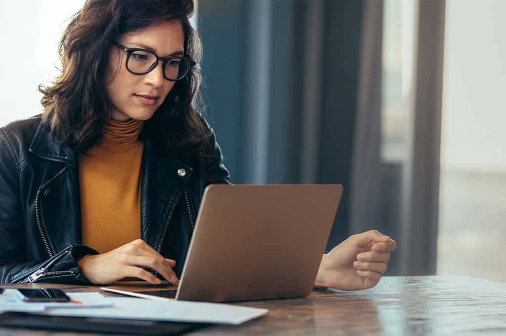 woman searching online for Can I Get Fired for Going to Rehab