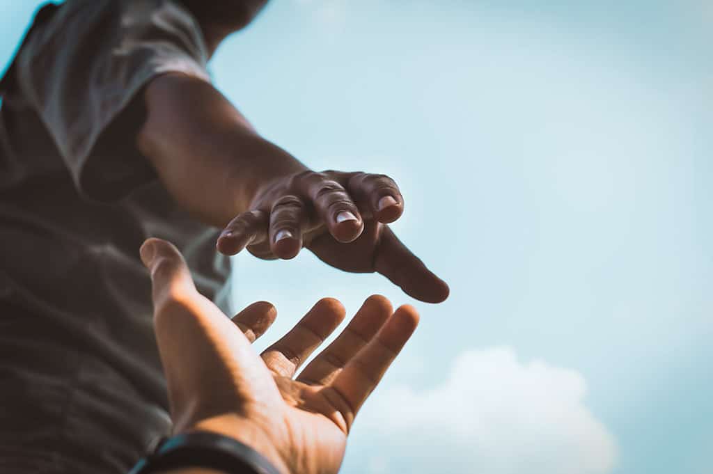 man reaching out for help help with How to Get Through Suboxone Withdrawal Safely