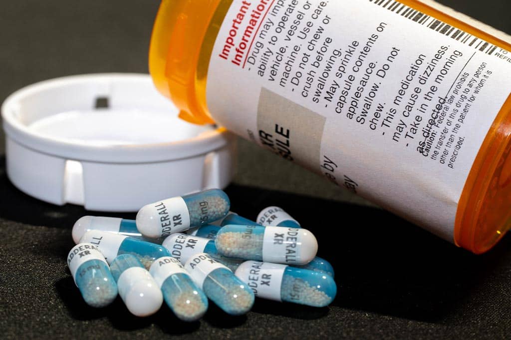 prescription bottle next too adderall pills