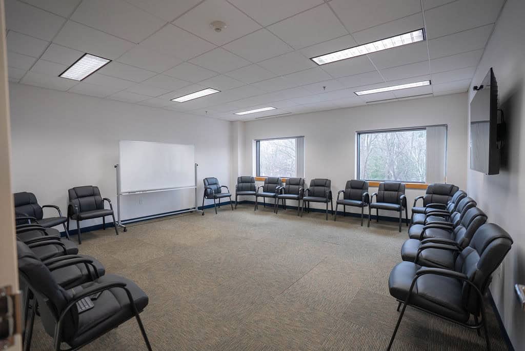 Group therapy room with circle seating at Rockland Recovery